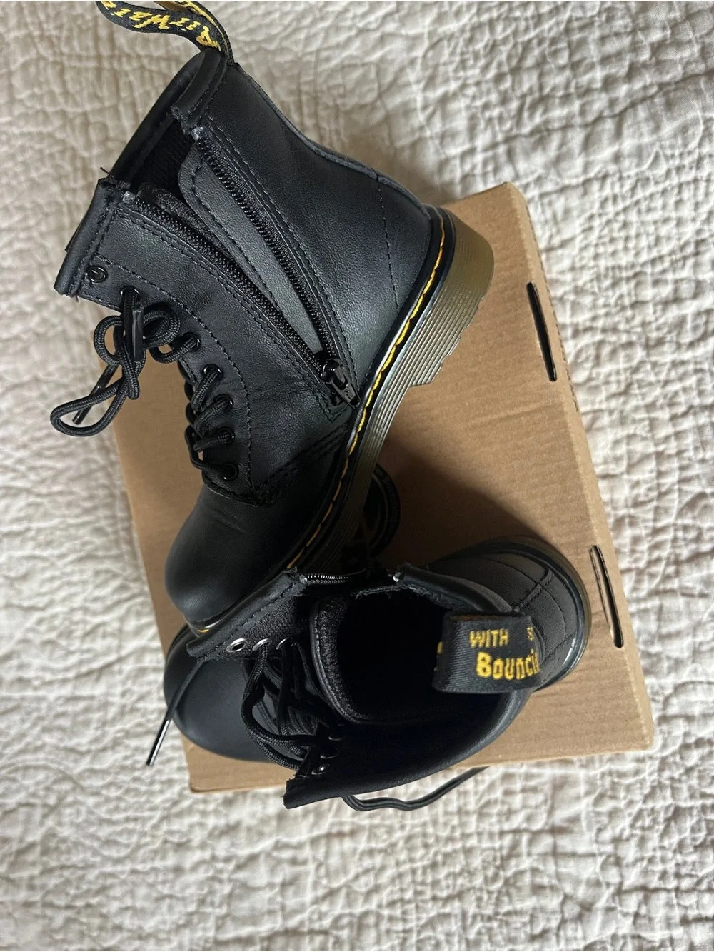 Kids Dr. Martens Black Leather Lace-Up Combat Boots with Yellow Stitching